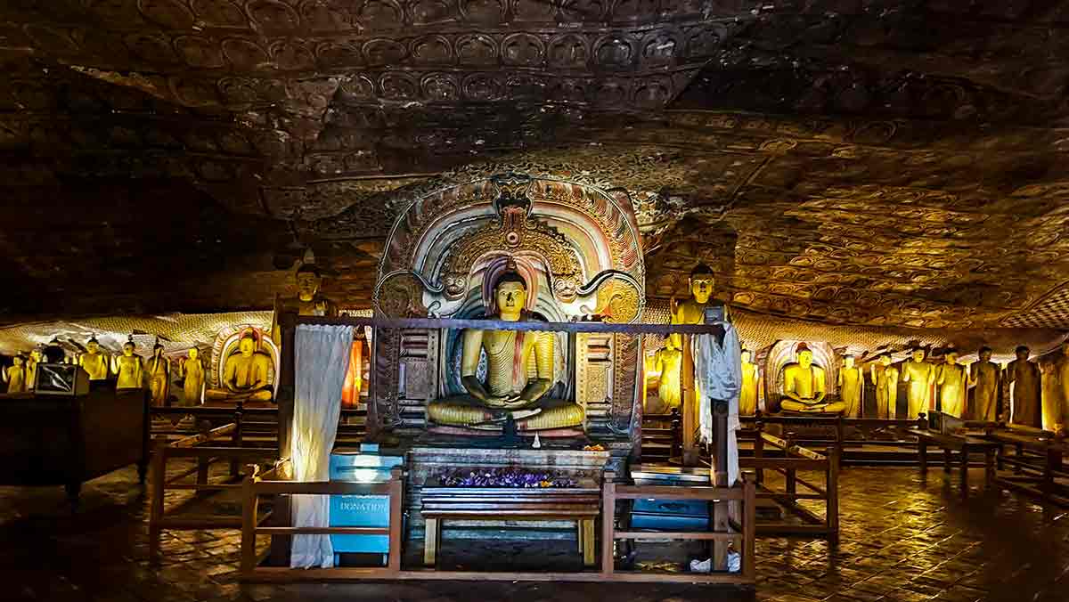 Reclining Buddha statue inside cave temple