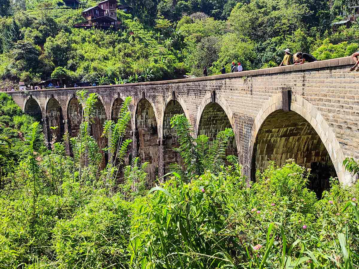 Tourists watching train crossing at Nine Arch Bridge